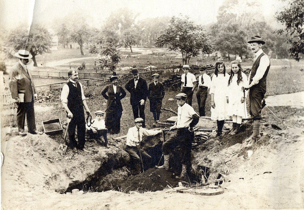 An Inwood dig site near the turn of the century. Reginald Bolton (left, sitting) and William Calver, standing to right of dig site.