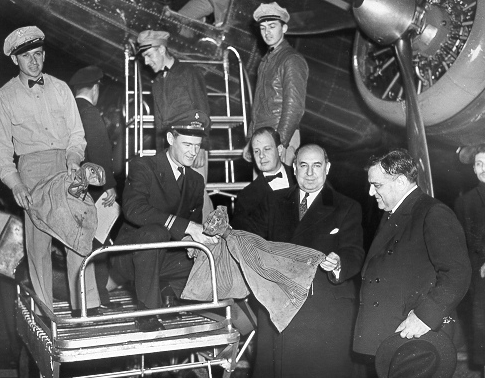 Postmaster General Albert Goldman receives first mail to be flown into LaGuardia Airport, Queens, NY, December 2, 1939.