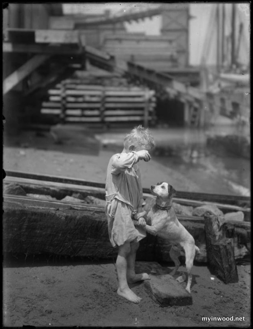 William Davis Hassler, barefoot son plays with dog on the shore of Harlem River, ca. 1910, NYHS.