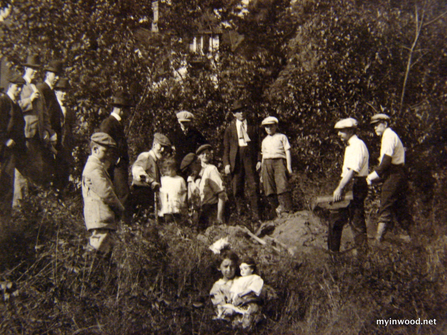Bolton and company with children on dig near Payson Avenue, undated.