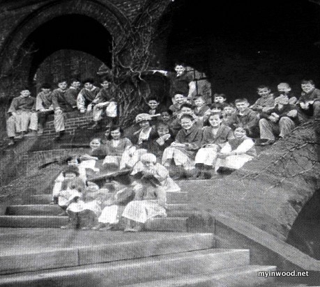 Children sitting on the steps of the old House o f Mercy after Society  for Prevention  of Cruelty to Children 1921 takeover.