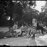 William Davis Hassler with four unidentified little girls in a park, talking and laughing, Isham Park, Inwood, New York City, undated ca. 1913-1914