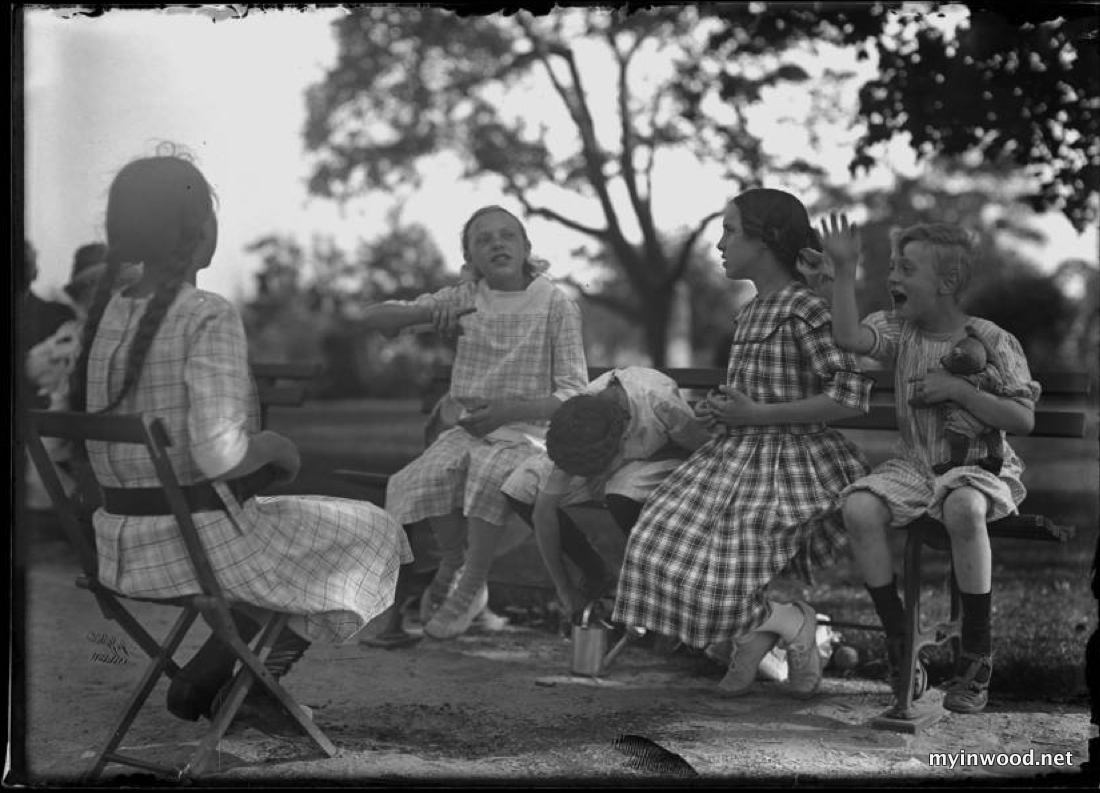 William Gray Hassler and four unidentified girls, seated on park benches, talking, Isham Park, Inwood, New York City, ca. 1913-1914, William Hassler, NYHS