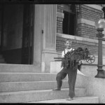 William Gray Hassler with garden wheelbarrow on the steps of 150 Vermilyea Avenue, Inwood, New York City, September 7, 1915, photo by William Hassler, NYHS