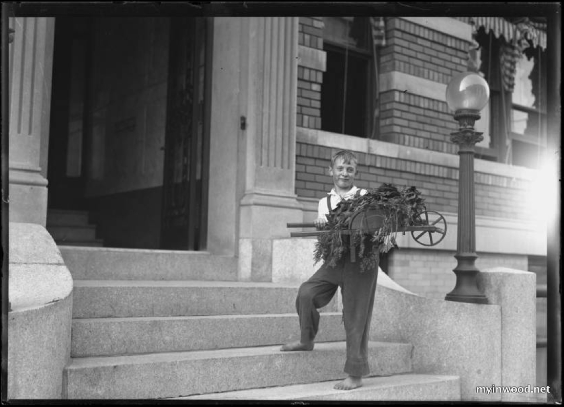William Gray Hassler with garden wheelbarrow on the steps of 150 Vermilyea Avenue, Inwood, New York City, September 7, 1915, photo by William Hassler, NYHS.