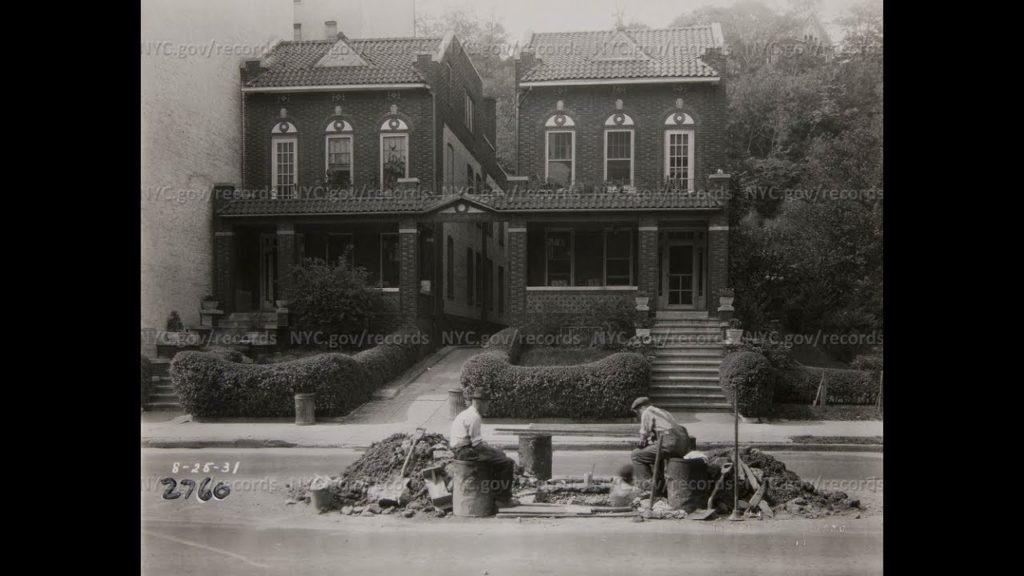 1931 photo of the Twin Houses from the New York Municipal Archives. 