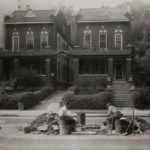 1931 photo of the Twin Houses from the New York Municipal Archives.