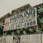 5051 Broadway, currently home is a pay parking lot, is being offered up in a Government auction.