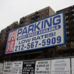 5051 Broadway, currently home is a pay parking lot, is being offered up in a Government auction.